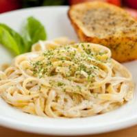 Alfredo Spaghetti · Customer's favorite of spaghetti style pasta beaded with alfredo chicken. Served with Italia...
