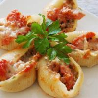Stuffed Shells · Fresh warm marinara sauce, cottage cheese, mixed with pasta shells. Served with a side of It...