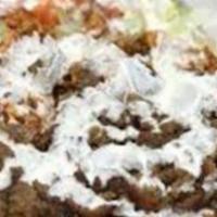 Chicken & Lamb Over Rice · Served with chicken, lamb,onion, peppers over rice and salad with white sauce. Comes with 1 ...