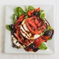 Fresh Mozzarella And Tomato · Homemade fresh mozzarella, sliced tomato and roasted red peppers served on a bed of spring l...