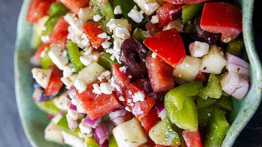 Greek Salad · Romaine lettuce, tomato, cucumber, red onion, black olives and feta cheese, served with our house dressing on the side.