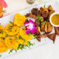 Tostones With Beef · Tostones with with pieces of fried beef