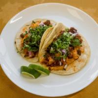 Taco Al Pastor · Spicy pork with pineapple soft taco and cilantro and onions only.