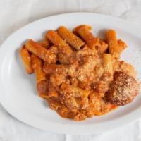 Penne With Homemade Red Meat Sauce · Baked penne pasta mixed with our homemade sauce, a touch of cream, crushed meatball, and Moz...
