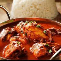 Chicken Masala · Boneless chicken cooked in Indian spices and gravy. Served with rice .
