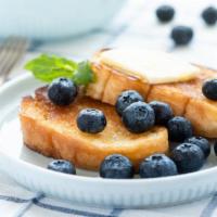 Blueberry French Toast · Classic French Toast cooked to perfection, topped with fresh Blueberries.