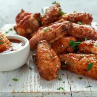 Buffalo Wings · Chicken wings breaded and fried to perfection, topped with Buffalo sauce. Served with carrot...