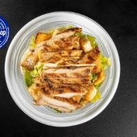 Classic Chicken Caesar Salad · Grilled chicken, romaine lettuce, Parmesan cheese, and croutons.