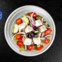 Greek Salad · Romaine lettuce, feta cheese, black olives, onions, tomatoes, and cucumbers.