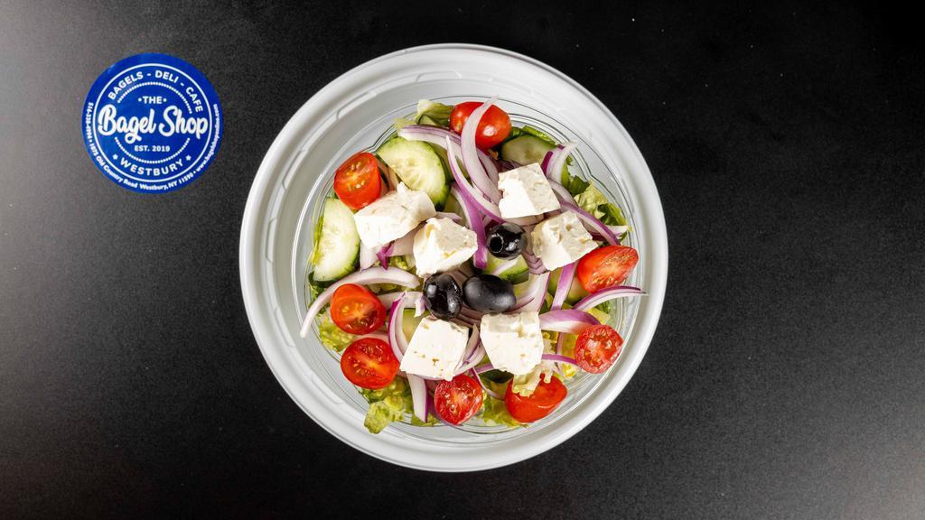 Greek Salad · Romaine lettuce, feta cheese, black olives, onions, tomatoes, and cucumbers.