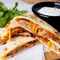Carnitas(Pork) Quesadilla · A large handmade flour tortilla stuffed with pulled pork, a blend of melted cheese, and pico...