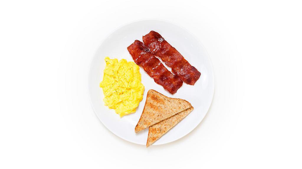 Farm Eggs · Two farm eggs scrambled and served with whole wheat toast and two strips of crispy turkey bacon.