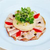 Vitello Tonnato* · traditional slow-roasted thinly sliced veal tenderloin, yellowfin tuna sauce, pickled capers...