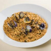 Risotto Di Mare · Carnaroli Riserva San Massimo rice, clams, mussels, scallop, Peekytoe crab, light tomato sauce