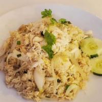Crab Meat Fried Rice · White crab meat, egg, white and green onion topped with cilantro and cucumber.
