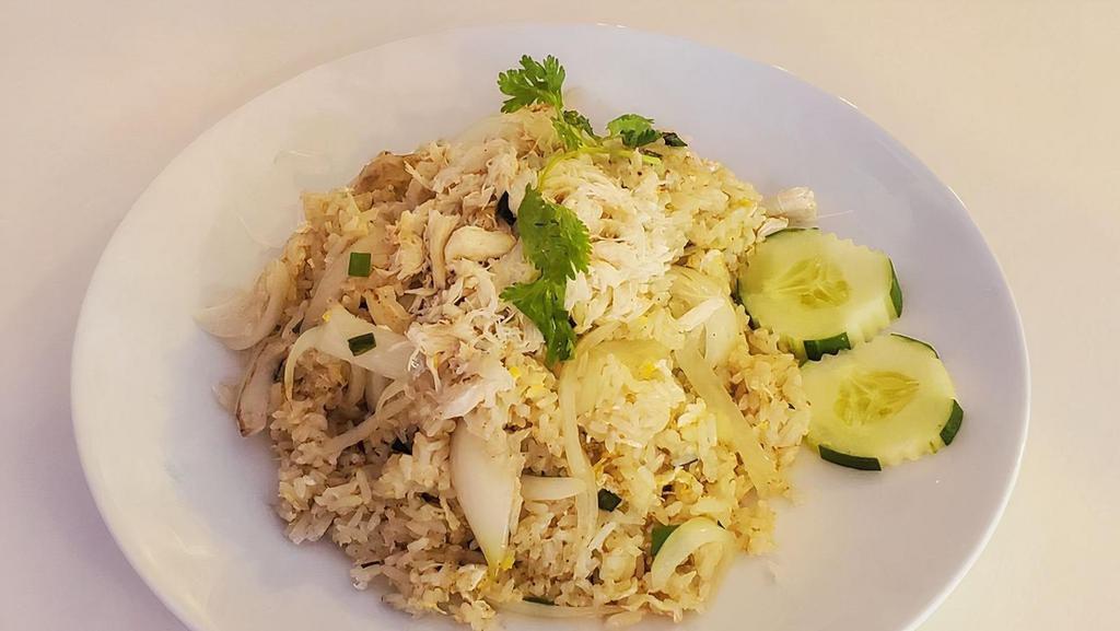 Crab Meat Fried Rice · White crab meat, egg, white and green onion topped with cilantro and cucumber.