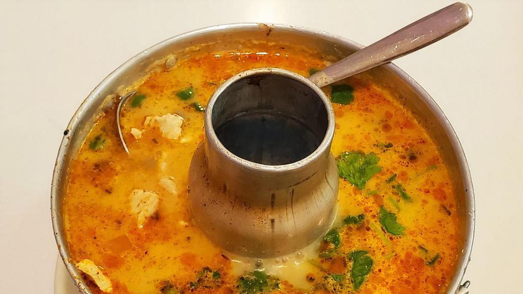 Tom Kha · Thai style coconut soup with your choice of meat, mushroom, kaffir lime leaves, galanga, lemongrass and cilantro.