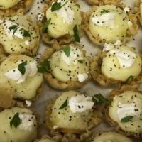 Goat Cheese And Potato Tartlets · Whipped potatoes with a touch of goat cheese topped with caramelized onions in a tartlet she...
