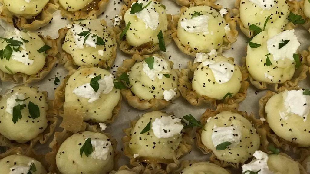 Goat Cheese And Potato Tartlets · Whipped potatoes with a touch of goat cheese topped with caramelized onions in a tartlet shell.