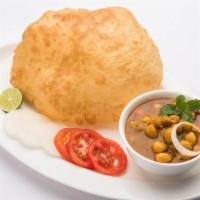 Chole Bhature · Deep fried whole wheat bread served with traditional Amritsari chole with pickles.