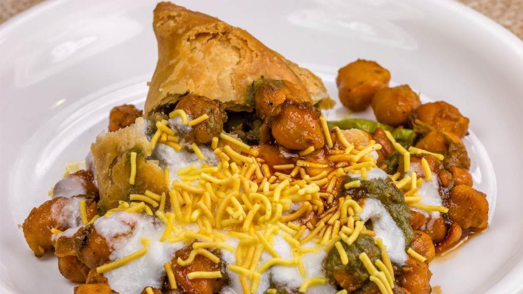 Aloo Tikki Chat · Spicy potato cakes served with seasoned chickpeas tamarind & mint chutney.
