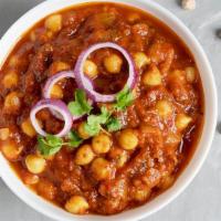 Chana Masala · Steamed chickpeas with onion, ginger garlic, tomatoes in homemade chat masala.