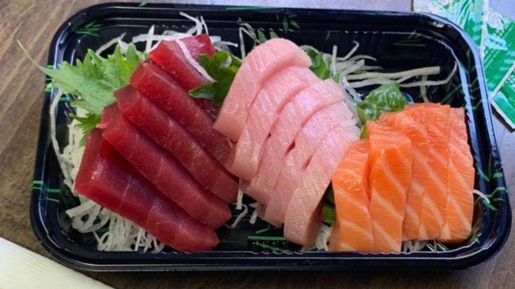 Tricolor Sashimi Dinner · Tuna (5 Pcs.), salmon (5 Pcs.), yellowtail sashimi (5 Pcs.).