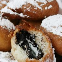 6 Deep Fried Oreos · 6 Pieces of deep fried Oreos topped with powered sugar.
