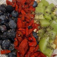 Sweet Ting Bowl · Kiwi, bluebarries, goji berries, chia seeds, and granola.