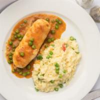 Chicken Rollantini · Served over sweet pea & roasted red pepper, parmesan risotto.