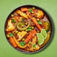 Classic Veggie Curry · Fresh seasonal vegetables sautéed to perfection with herbs, ground spices, red onions and pe...