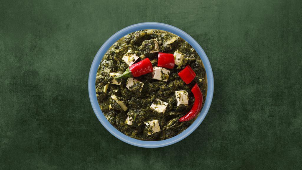 Green Cottage Cheese Curry · Indian cottage cheese cooked with fresh spinach an Indian herbs and spices and cream.