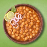 Spiced Chickpea Curry · Delicious and flavourful Indian curry made by cooking chickpeas in a spicy onion tomato masa...