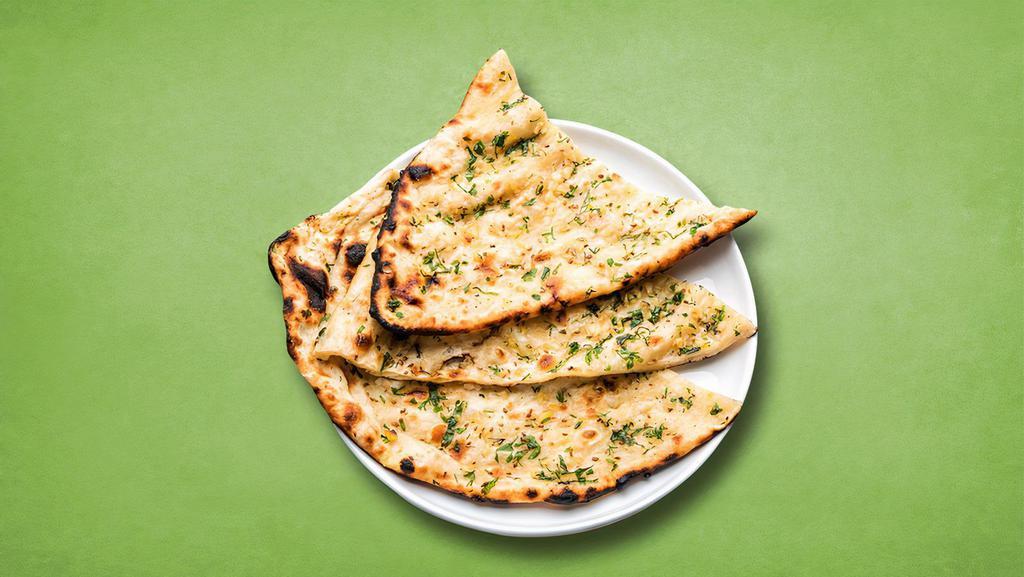 Dream Garlic Naan · A whole wheat bread baked in tandoor grill and topped with garlic.
