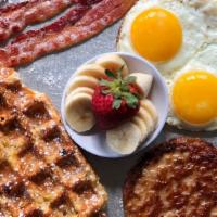 The Belgian Breakfast · Two eggs any style, 2 bacon strips, 1 sausage patty and an original waffle. OUT OF SAUSAGE W...