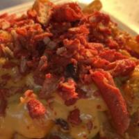 Taki'S Cheese Fries · Spicy. Hot Takis covered in melted nacho cheese sauce.