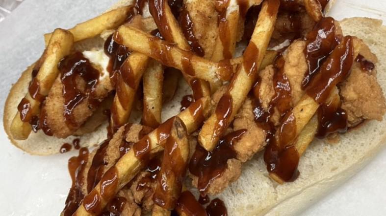 Fat Patriot Sandwich · Crispy chicken, mozzarella sticks, fries, onion rings, and honey barbecue.