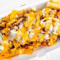 Chipotle Philly Cheese Fries · Cheesesteak, jalapeños, onions, pepper jack cheese, and chipotle sauce.