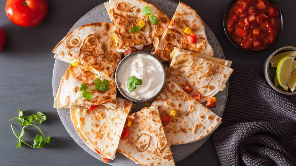 Buffalo Chicken Quesadilla · Grilled tortilla filled with buffalo chicken, cheddar cheese, and pepper jack cheese.