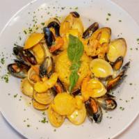 Seafood Risotto · Clams, mussels, shrimp, scallops, saffron cream sauce.