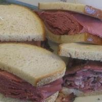 Corned Beef & Pastrami · Cole slaw and Russian dressing.