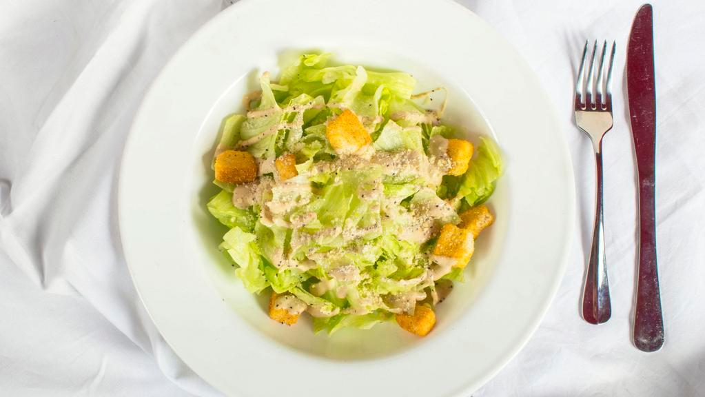 Caesar Salad · Romaine, fresh Parmesan, garlic.