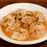 Momo (10 Pcs.) · Himalayan Dumplings served with choice of meat & sauce. 
Jhol or Dipping sauce