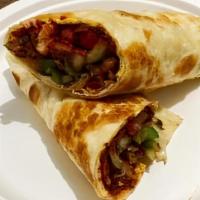 Katti Roll · Roti or chapati filled with chicken tikka or vegetables, peppers and onions flavored with sp...