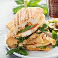 Chicken Club Panini · Grilled Panini Sandwich made with Grilled chicken, smoked bacon, brie cheese, plum, tomatoes...