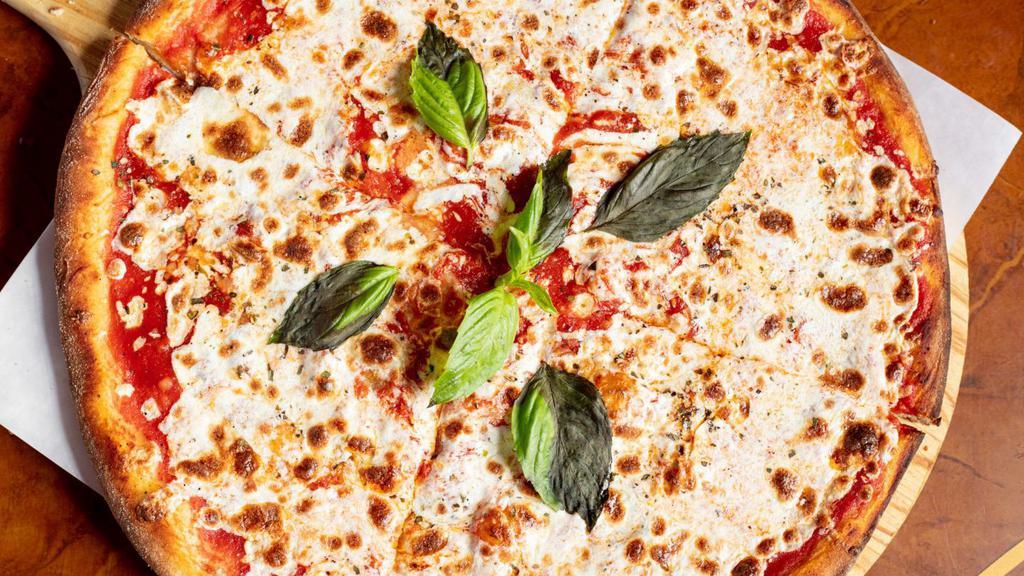 Pizza Margherita · Tomato sauce, mozzarella and basil.