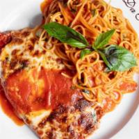 Pollo Parmigiana · Breaded chicken cutlet topped with mozzarella and tomato sauce.