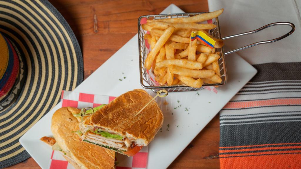 Sandwich De Pollo · Chicken Sandwich with lettuce ,tomato , cheese, and French Fries