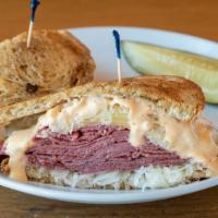 Reuben Melt · Streaming Hot Corned Beef, Melted Swiss Cheese With Sauerkraut, Mustard, or Russian Dressing.