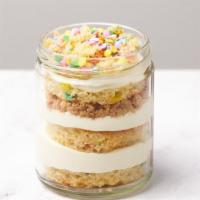 Birthday Cake Jar · Rainbow vanilla cake, white chocolate chantilly cream, and almond crumble.